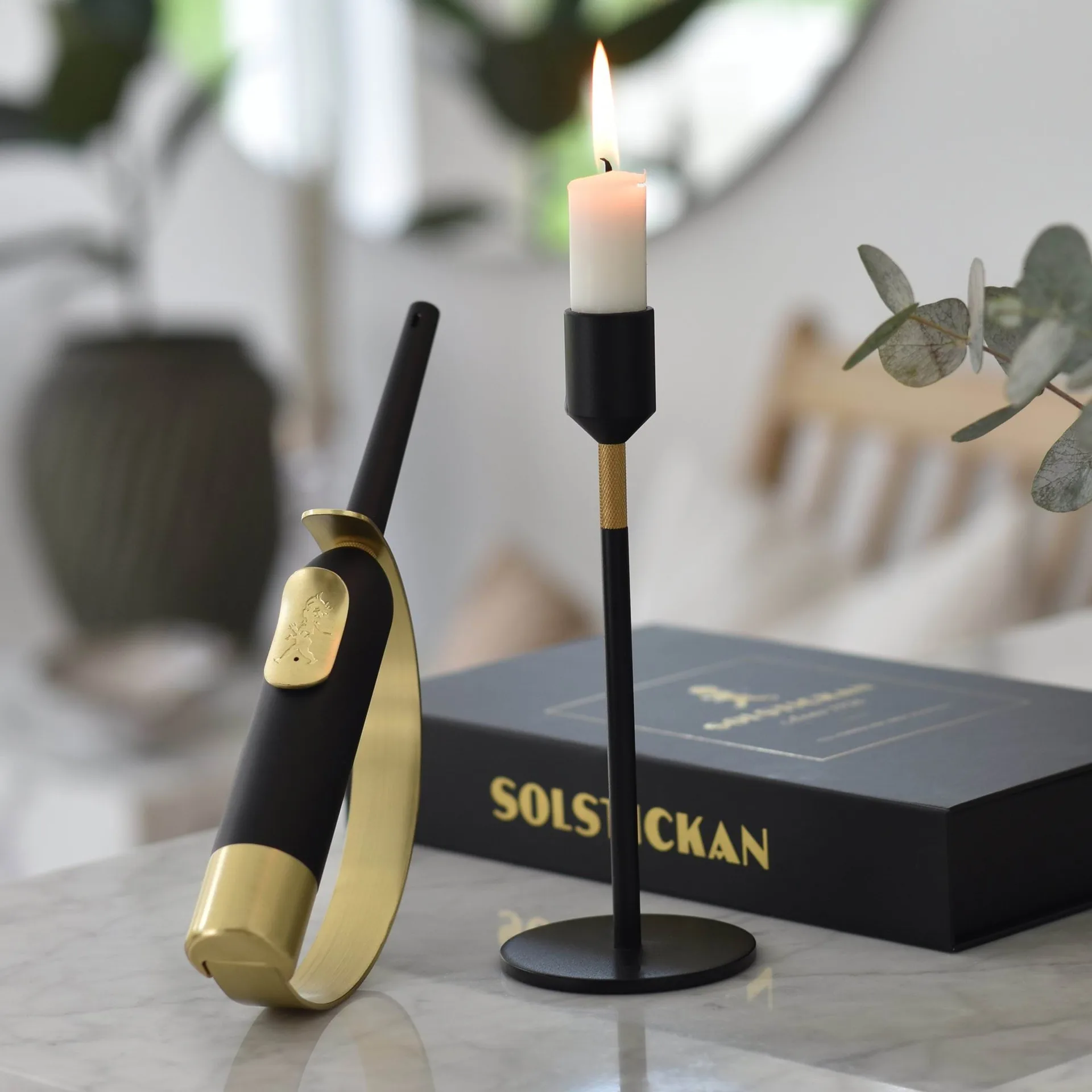 Solstickan Eldklinga lighter, Black-brass Solstickan Design