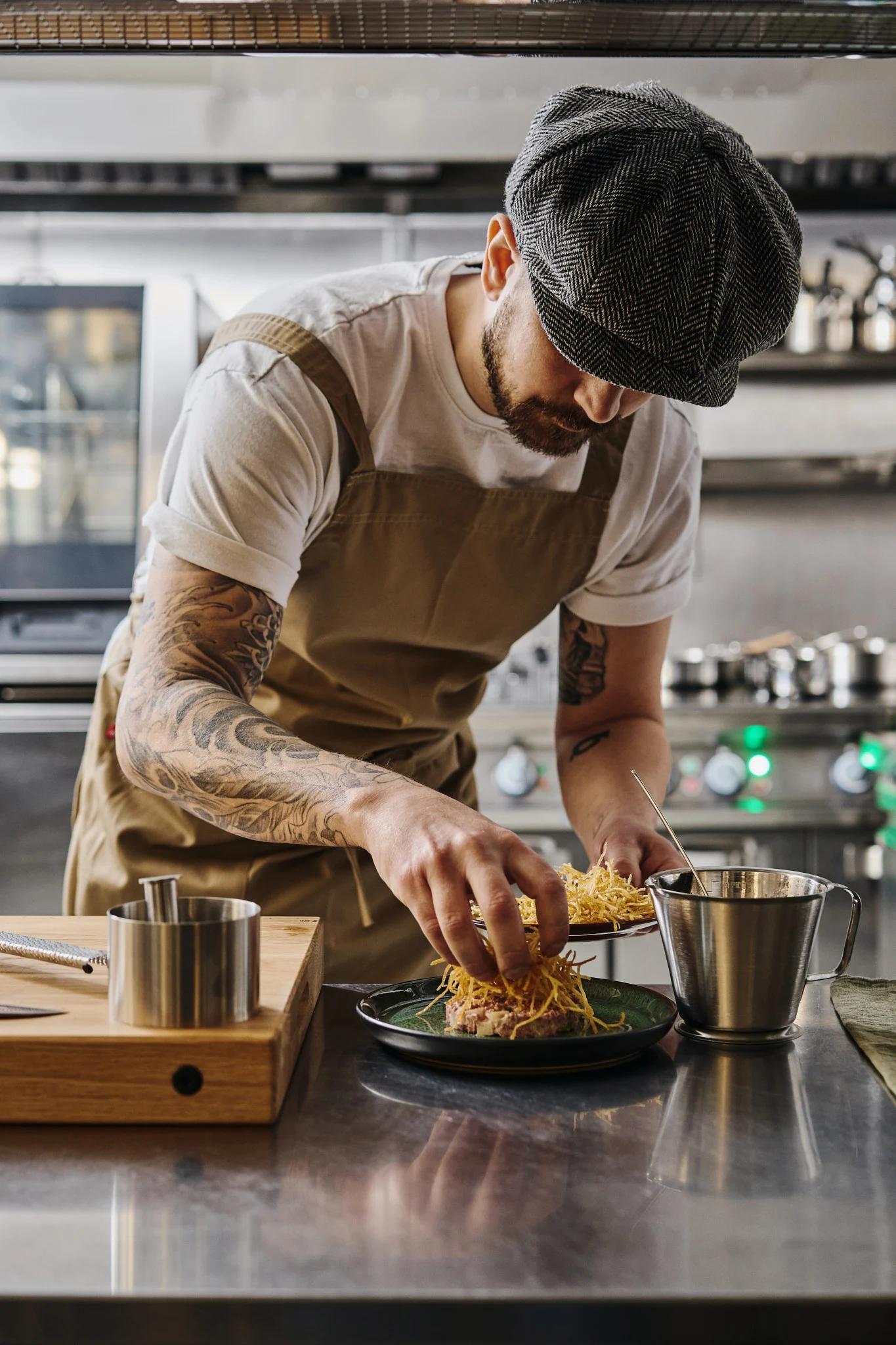 Discover how to plate like a professional. Here you see a chef placing the final elements on a dish.