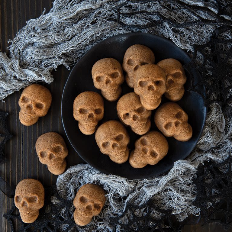 Spooky Halloween cake ideas like these skull-shaped cake bites made using the Nordic Ware skull cake tin are ideal for your next Halloween party. 